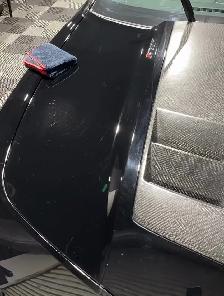 The same black wing after machine polishing