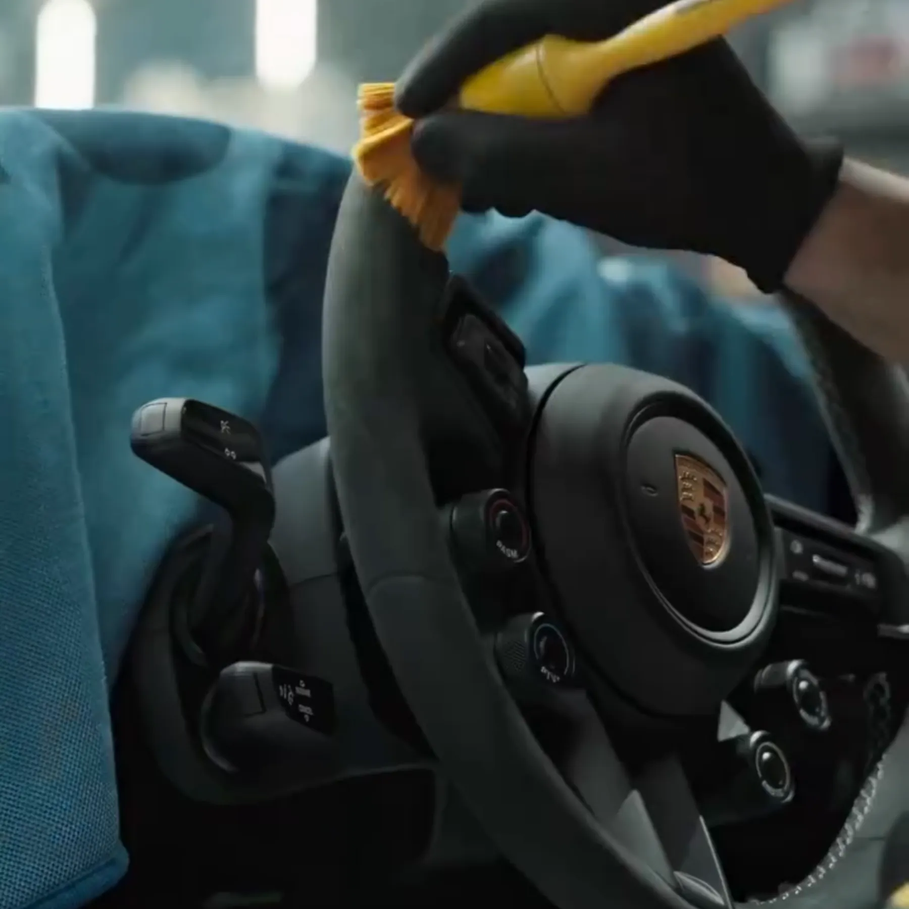 Detailing brush working around a leather steering wheel